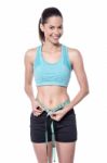 Slim Young Lady Measuring Her Waist Stock Photo