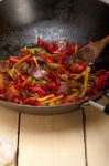 Fried Chili Pepper And Vegetable On A Wok Pan Stock Photo