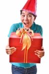 Woman Smile And Hold Gift Box In Hands Stock Photo