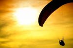 Silhouette Of Parachute On Sunset Stock Photo