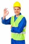 Smiling Builder Showing Thumb Up Stock Photo