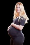 Pregnant Woman Holding Tummy Stock Photo