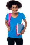 College Student Carrying Back Pack, Book And Clipboard Stock Photo