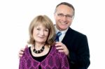 Elderly Couple Smiling To The Camera Stock Photo