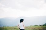 Relax Asian Girl In Mountainous Scenery Stock Photo