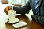 Cropped Image Of Businessman At Coffee Shop Stock Photo