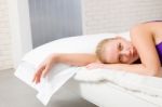 Woman Lying On Bed Stock Photo