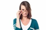 Attractive Woman Holding Her Eyeglasses Stock Photo