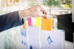 Close Up Shot Of Hands Of Business Man Sticking Adhesive Notes O Stock Photo