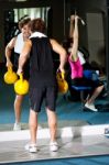 Athletic People Working Out With Equipments Stock Photo