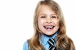 Face Closeup Of A Cheerful Young School Girl Stock Photo