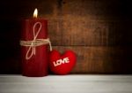 Candle Light With Red Heart Symbol Background Stock Photo