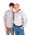 Teenager And Grandfather, In Studio Stock Photo