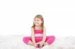 Little Girl Sitting On Floor Stock Photo