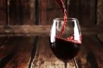 Close Up Of Pouring Wine In Glass Stock Photo