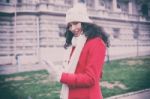 Beautiful Woman In Red Coat And Wool Cap And Gloves With Smartph Stock Photo