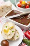 Slices Of Bread And Butter With Tomatoes, Peppers And Pate Stock Photo