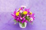 Bouquet Of Chrysanthemum And Orchid Flowers Isolated On Purple V Stock Photo