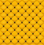 Yellow Leather Wall With Black Button On Grid Stock Photo