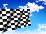 Checkered Flag Over A Sky Background Stock Photo