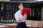 Asia Thai High School Student Uniform Beautiful Girl Read A Book Stock Photo