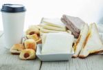 Breads And Coffee Cups On Wooden Stock Photo