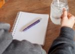 Woman's Hand Holding A Cold Glass Of Water Stock Photo