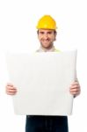 Male Construction Worker Holding Blueprint Stock Photo