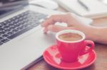 Red Coffee Cup With Notepad And Laptop Stock Photo