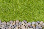 Stone On Grass Background Stock Photo