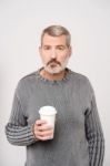 Elderly Man Holding Beverage Stock Photo