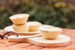 Mini Pies On Wooden Plate Stock Photo