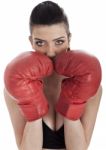 Woman Covering Her Mouth With Red Gloves Stock Photo