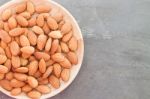 Almond Nuts On Wooden Plate Stock Photo