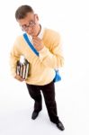 Male Student Standing And Thinking Stock Photo