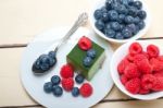 Green Tea Matcha Mousse Cake With Berries Stock Photo