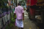 Man Walking Though The Streets Of India Stock Photo