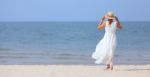 Woman On Beach Stock Photo