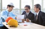 Team Of Young And Senior Engineering Man Project Meeting In Working Office For Project Discussion Stock Photo