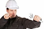 Handyman Wearing Uniform And Hardhat Stock Photo