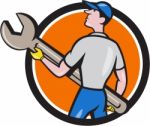 Mechanic Carrying Giant Spanner Circle Cartoon Stock Photo