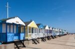 A Row Of Brightly Coloured Beach Huts In Southwold Suffolk Stock Photo