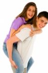 Teenage Boy Piggybacking Girl Stock Photo