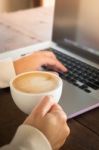 Woman Working With Laptop And Hot Coffee Stock Photo