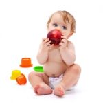 Cute Infant Boy With Apple Stock Photo