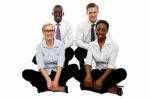 Business Team Sitting On Floor Stock Photo