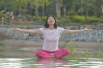 Women Practices Yoga Stock Photo