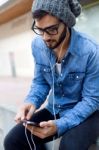 Modern Young Man With Mobile Phone In The Street Stock Photo