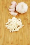 Garlic Preparation Ways On A Cutting Board Stock Photo