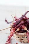 Dried Chilly On Wooden Stock Photo